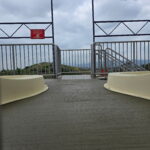 Citrus Bloom Landscape team finishing a freshly poured concrete surface for a driveway or patio.