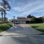 Citrus Bloom Landscape team installing plants, trees, and decorative elements in a residential yard.