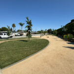 Citrus Bloom Landscape team enhancing a public park with fresh lawns, trees, and colorful plants.